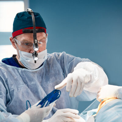 Surgeon assistant feeds coagulator, plastic surgery, professional doctors, close-up
